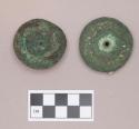 Metal, copper alloy ear spool fragments, possible fiber impressions around center hole