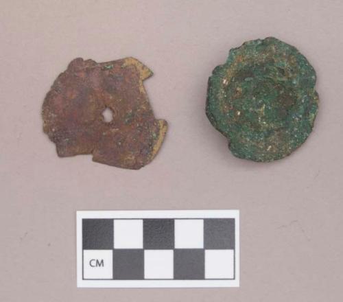 Metal, copper alloy ear spool fragments, one with possible cut marks