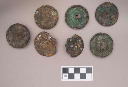 Metal, copper alloy ear spool fragments, with possible iron covering