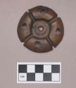 Metal, copper alloy ear spool fragment, five perforations, molded