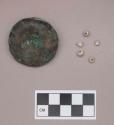 Metal, copper alloy ear spool fragment; pearl beads and bead fragments