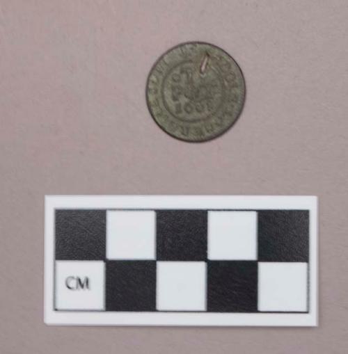 Metal, copper alloy coin, half penny trade token, perforated, impressed on one side with "...HOOLE LANE RATCLIFFE / T / PT / 1668", on the other side with "HIS / HALF / PENY / BAKER ..."