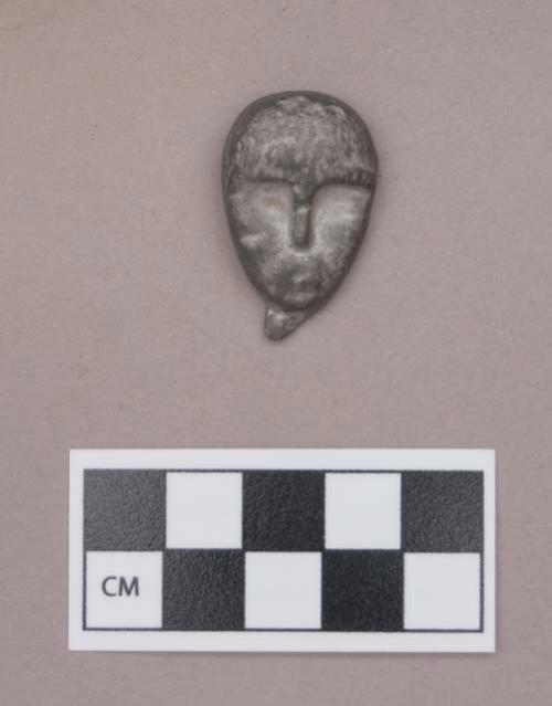 Metal, cast lead, human head figurine