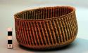 Round basket with brown stripes