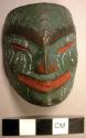 Miniature green wooden mask