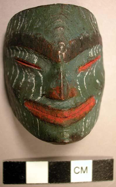 Miniature green wooden mask