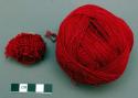 Balls of red woolen thread