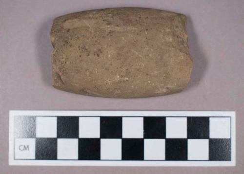 Ground stone, perforated fragment, possible gorget