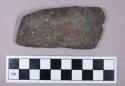 Ground stone, weathered celt fragment