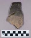 Ceramic, earthenware, rim sherd with impressed decoration, mended