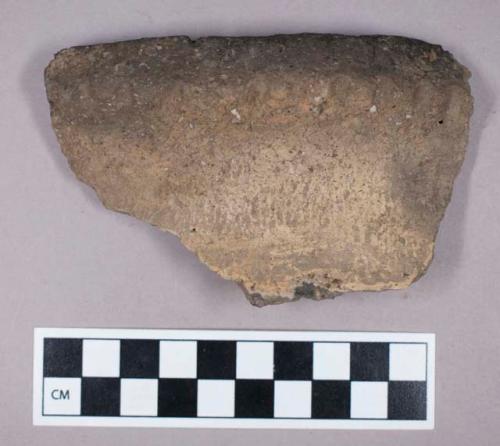 Ceramic, earthenware, rim sherd with impressed decoration