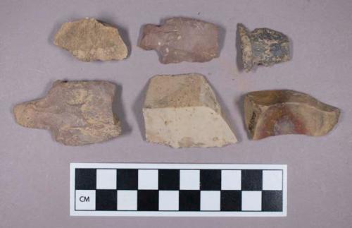 Ground and chipped stone, gouge fragment with side-notched and stemmed bifaces, unifaces, and secondary flakes