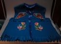 Satin-lined felt vest with fringe, and multicolor bead embroidery.