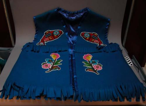 Satin-lined felt vest with fringe, and multicolor bead embroidery.