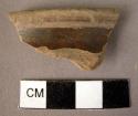 Rim potsherd - slipped, burnished, reserve band