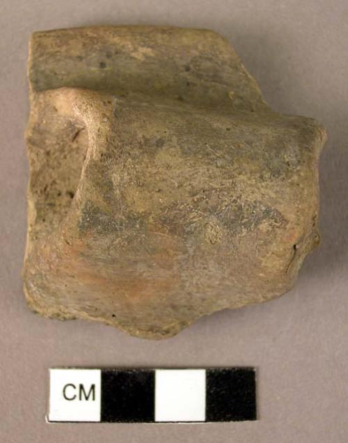 Straight rim potsherd with band handle with imitation rivet