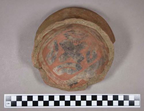 Ceramic, earthenware base sherd with flared foot, polychrome slipped interior, undecorated exterior