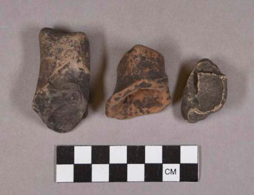 Ceramic, earthenware body, base, and handle sherds, undecorated, one with modeled foot