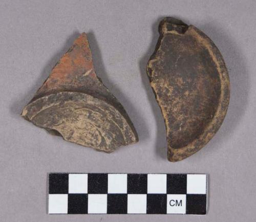 Ceramic, earthenware base sherds, includes polychrome slipped, and one ground stone fragment