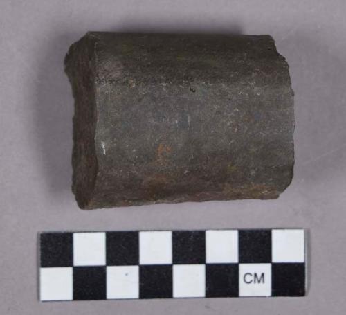 Ground stone, fragment of cylinder shaped object, fractured ends