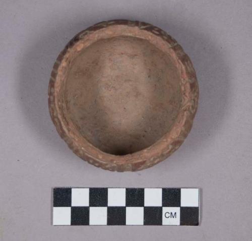 Earthenware bowl with carved designs