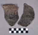 Ceramic, earthenware rim and body sherds, shell-tempered, cord-impressed, punctate, and incised, strap handles