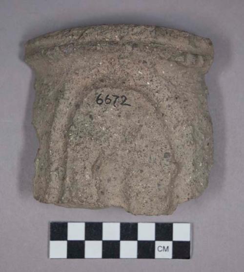 Earthenware rim sherd with finger impressed design on exterior