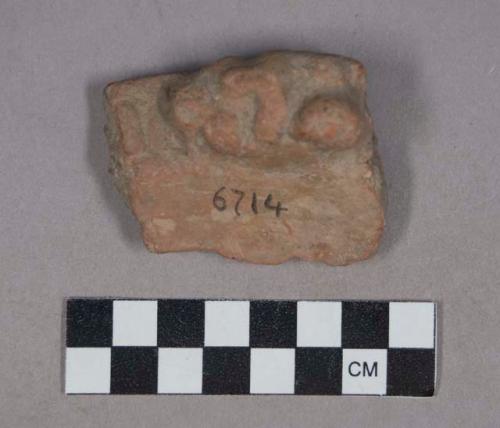 Earthenware rim sherd with modeled handle