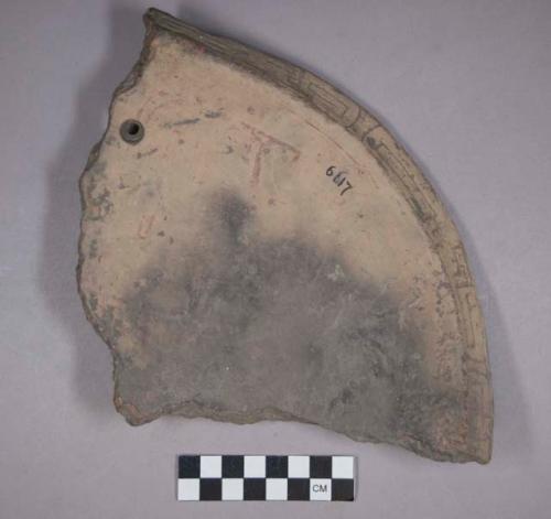 Earthenware rim and body sherd with incised designs on rim