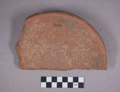 Earthenware base sherd with incised designs and pedestal base