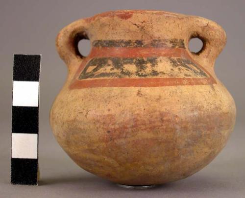 Pottery jar, with handles, yellow, with black and red orn.