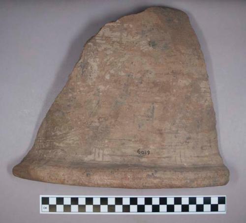 Earthenware rim and body vessel sherd with incised designs