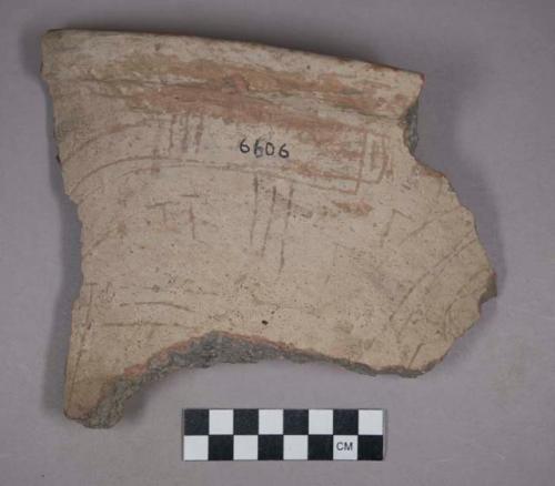 Earthenware rim and body sherd with incised designs