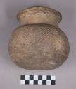 Earthenware vessel with incised designs around body