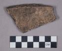 Earthenware rim sherd with indentations