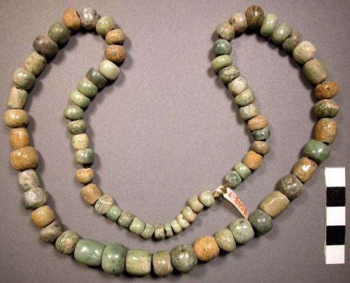 Ground stone; beads; discoidal, round, & tubular; strung together