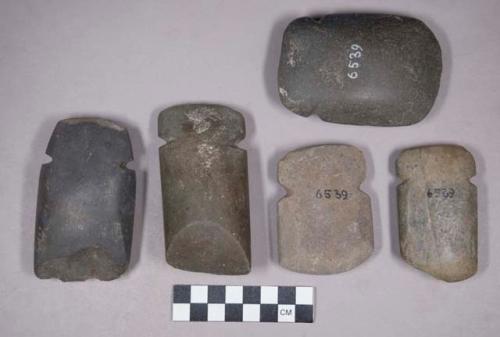 Ground stone axes, notched