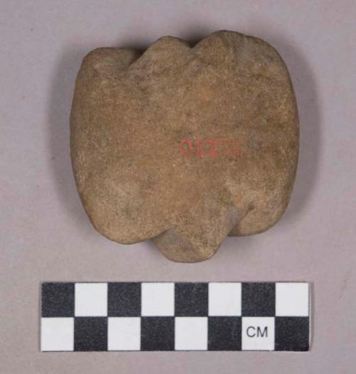 Ground stone edged tool with notches