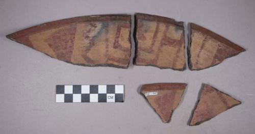 Earthenware rim and body sherds with polychrome designs on interior and exterior