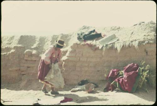 Woman in front of wall