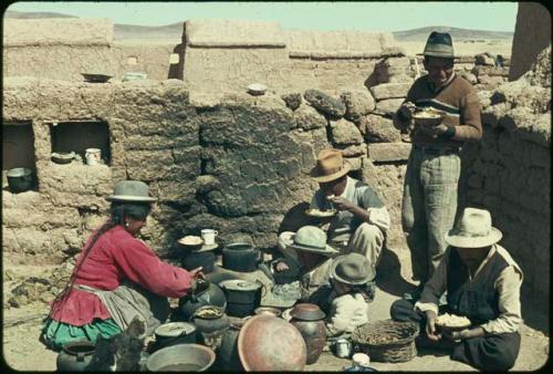 Family eating in front of the fire