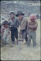 Children with digging tool