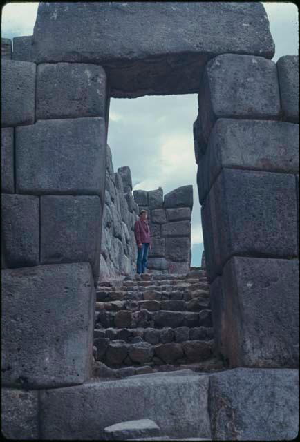 Stone doorway of fortress, with Ray Warburton on stairway