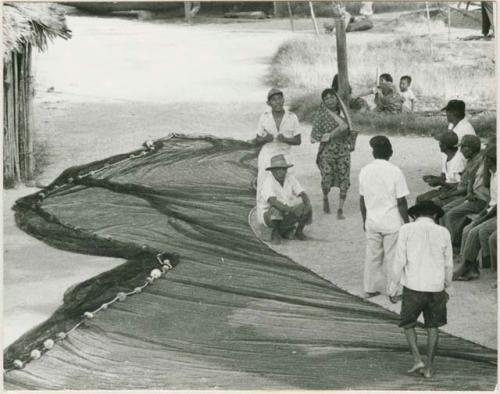 Men preparing a fishing net