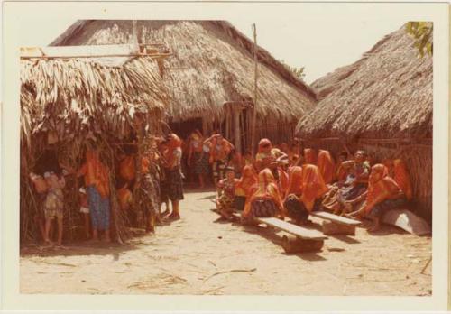 Young girl, secluded in hut (left), for whom the fiesta is given has her hair cut