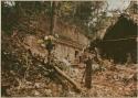 View of camp shelter (right) next to Maya structure