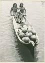 Two women transporting gourds on the river