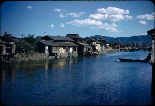 Boats and houses along waterway