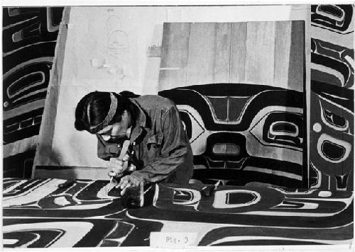 Nathan Jackson carving wood proscenium doorway at Peabody Museum, 1974.