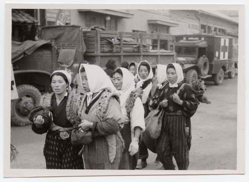 Group of women dressed in work clothes